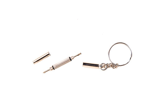 Tiny silver screwdriver keychain eyeglass kit in pieces top down