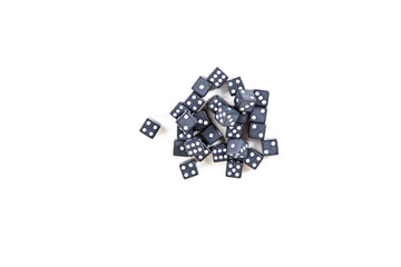Tiny black and white dice pile isolated over white top down