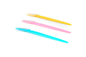 Blue pink and yellow disposable beauty shaving razor top down