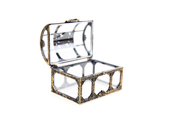 Small gold and glass treasure chest open and isolated over white angled view