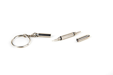 Tiny silver screwdriver keychain eyeglass kit in pieces side view