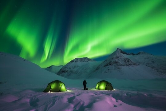 Winter camping amidst snowy mountains with mesmerizing Northen polar lights illuminating the green sky. Generative AI