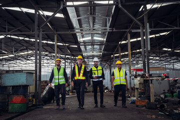 Portrait of Group of Team Mechanical Engineers at Factory Machines. Worker industry collaboration.. .