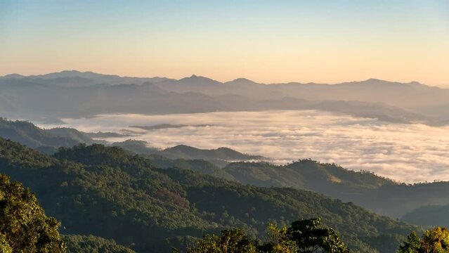 Tropical forest nature landscape view with mountain range sunrise with moving cloud mist at Huai Nam Dang National Park, Chiang Mai Thailand