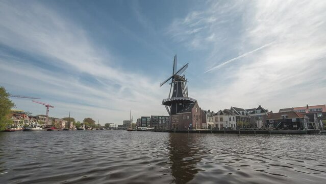 Haarlem Netherlands time lapse, city skyline timelapse at Windmill Adriaan and canal waterfront