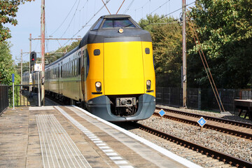 Fototapeta premium ICM Koploper intercity train of NS running along Nieuwerkerk aan den IJssel