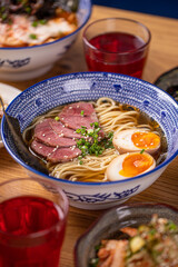 Asian ramen noodle soup dishes with salads