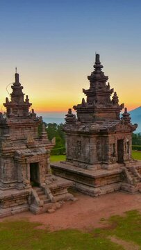 Beautiful sunrise of Gedongsongo temple with mountain on background. Vertical video for social media platform, Instagram reels youtube shorts and tik tok content.