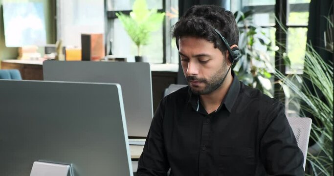 Middle Eastern businessman expresses disappointment and frustration upon receiving distressing news on computer. His emotional response underscores the impact that information.