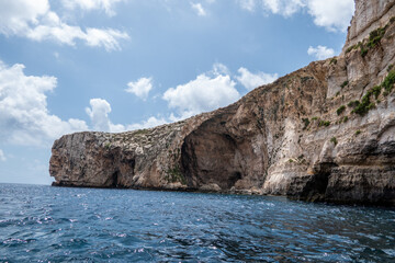 Fototapeta na wymiar Wied iz Zurrieq, Malta, May 2, 2023. Set of marine caves around the Blue Grotto. They form one of the most beautiful natural landscapes in Malta.