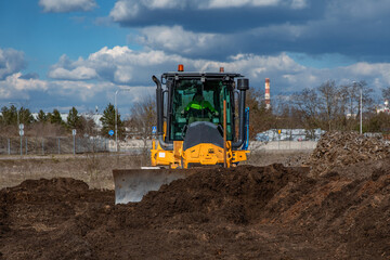 Modern bulldozer (crawler dozer) at work in the field.