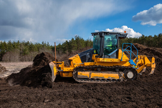 Modern bulldozer (crawler dozer) at work in the field.