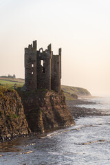 Lovely and romantic place on east coast of scottish highlands. Old Keiss castle standing on cliff and maybe in few years he will fall down. Iconic castle in scotish landscape.