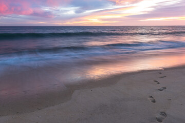 Sunset at sandy beach on Altantic Ocean coast in Portugal