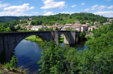 Fototapeta na wymiar Bridge of Chambonas over the river Chassezac in Ardeche in France, Europe