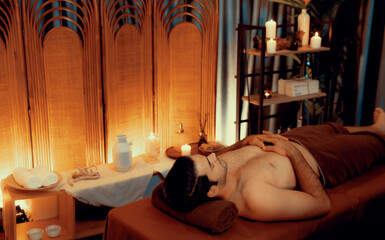 Caucasian man customer enjoying relaxing anti-stress spa massage and pampering with beauty skin...
