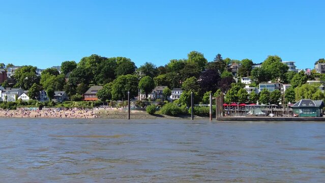 Coastline of Hamburg, Germany with beautiful buildings along the Elbe River. Elbe beach (Elbstrand) &Ouml;velg&ouml;nne.