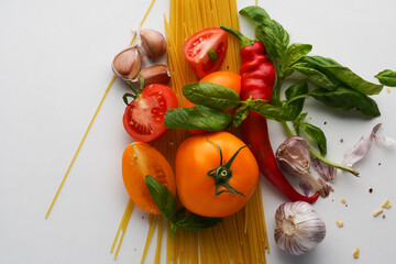 close-up of fresh tomatoes and garlic with basil leaves. Fresh good food for cooking