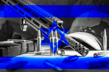 The flag of Israel against the background of weapons and ammunition.