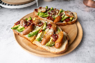 the avocado toast made with sourdough and tomato. healthy eating.