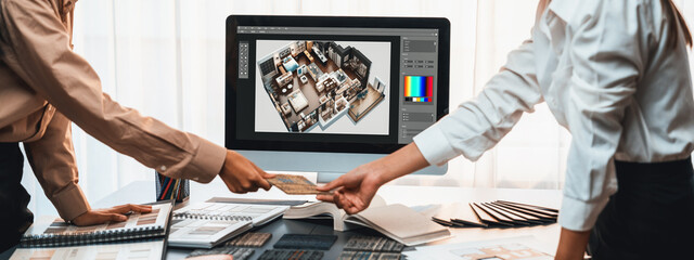 Group of interior architect designer team at table choosing various mood board samples with...