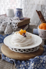 Meringue cake with tangerines