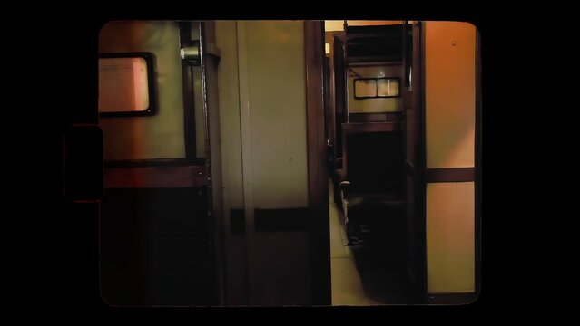 Walking in slow-motion in the past: a fake Super 8mm film of an empty real original passenger train's cabin made in the 1960s. Nobody inside.
