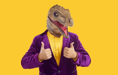 Always stay positive, guys. Creative shot of happy man wearing purple fancy dress velvet suit and...