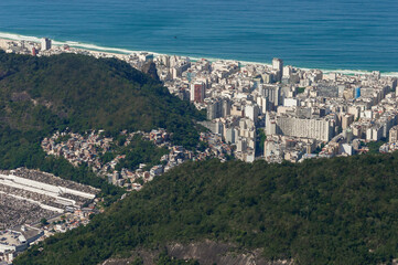 Naklejka premium Copacabana beach seen from the Corcovado, strong contrast between coastal rich area and hill poor neighborhood in Morro Sao Joao