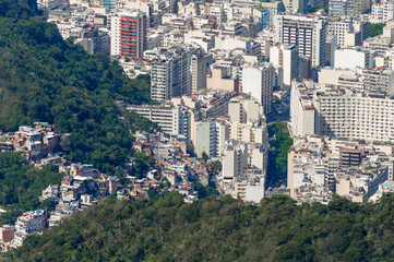 Aerial view of a detial of Rio de Janeiro. Small comunity neighborhood on the San Joao hill in contrast with the modern highrise buildings in the coastal area