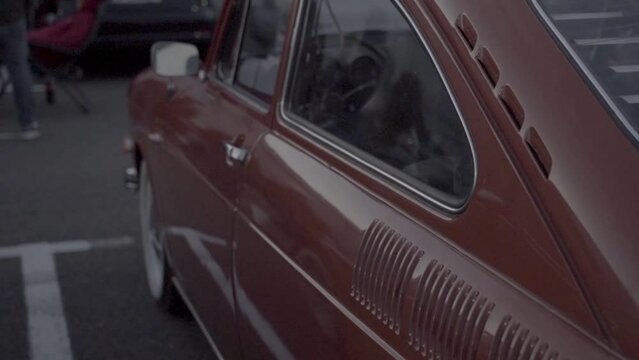 old classic car in the street on slow filmshot