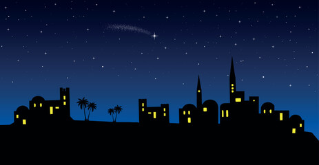 Christmas nativity scene: Bethlehem city skyline in the desert at night.