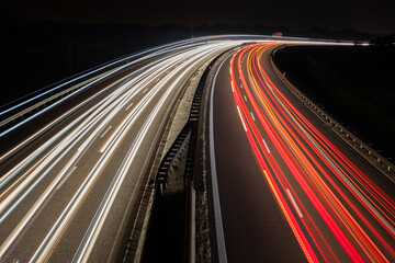 Fototapeta na wymiar Traffic on highway at night.