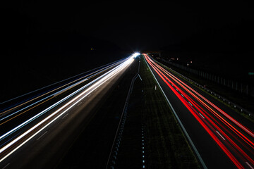 Fototapeta na wymiar Traffic in motion blur. Traffic on highway at night.