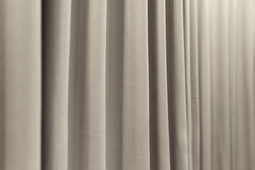 Obraz premium White curtain that dropped down as a straight line. Background for inserting text, empty spaces.