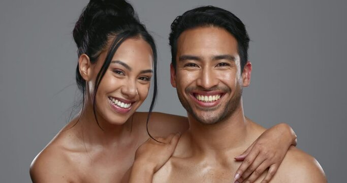 Couple, smile and care for skincare, face and portrait for wellness in studio by gray background. Happy people, dermatology and hug for cosmetics, hydration and glow or natural skin treatment