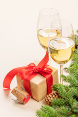 Christmas fir tree branch, champagne and gift box