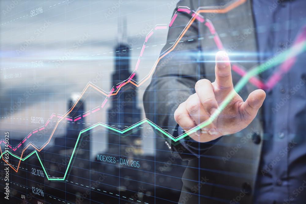 Poster Close up of businessman hand pointing at creative business graph with index and grid on blurry city background. Stock market and financial statistics concept. Double exposure.