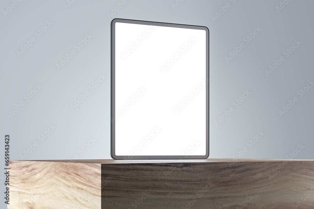 Poster Close up of empty white tablet screen on wooden surface and gray wall background. Product presentation and advertisement concept. Mock up, 3D Rendering.