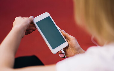 Anonymous woman messaging on smartphone
