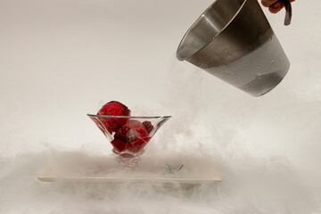 ice cream in a cup, in a white plate in a fog of liquid nitrogen six

