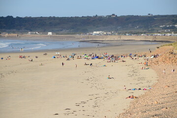 St.Ouen's Bay, Jersey, U.K. Very unusual scene of people on the beach and in the water on 8th October.