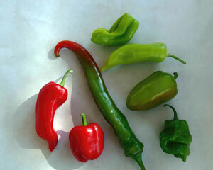 Assorted fresh peppers from garden .