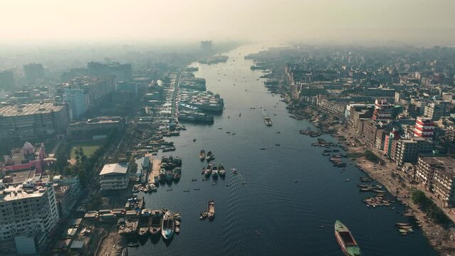 Aerial view of Dhaka city, the vibrant and bustling capital of Bangladesh. The cosmopolitan city is a blend of modern and traditional, with towering skyscrapers, bustling markets. Buriganga