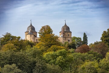 Fototapeta na wymiar The Sababurg in Reinhardswald near Kassel in autumn, also called Sleeping Beauty's fairytale castle