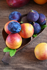 ripe fruits on the table, nectarines, plums, figs close-up