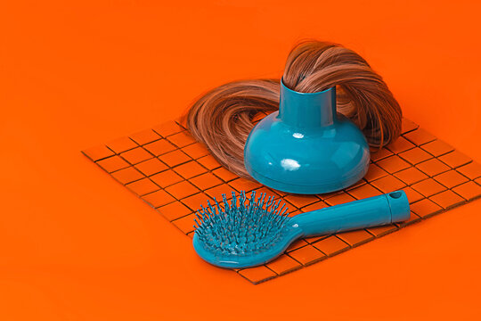 Hair dryer with extensions near hair brush