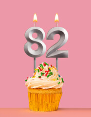 Birthday card with cupcake and candle number 82