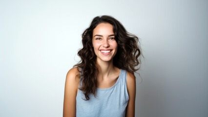 Fototapeta premium Portrait of Young Brunette Woman Smiling Cheerfully