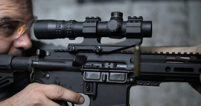 Detail Close-Up of Finger Pulling Trigger on Assault Rifle, Multipel shots in Super Slow-Motion 800 fps